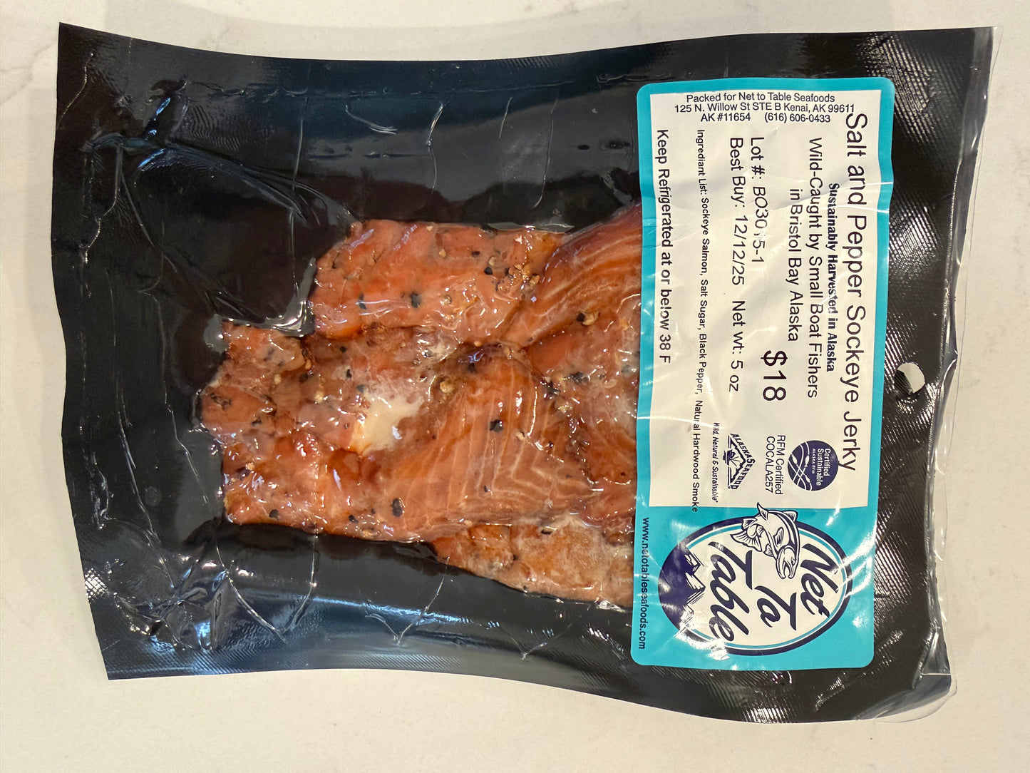 Salt and pepper sockeye salmon jerky 5oz vacuum-sealed package from Net to Table, wild-caught Bristol Bay Alaska