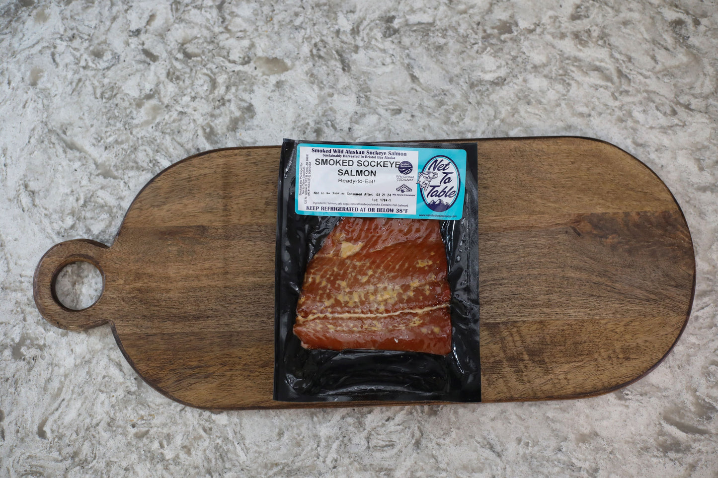 Smoked Alaskan Sockeye Salmon Portion (add on) - Net To Table Seafoods Smoked Wild Alaskan Sockeye Salmon from Net to Table Seafoods packaged and ready to eat. Sustainably harvested in Bristol Bay, Alaska, RFM certified smoked salmon on a wooden serving board.