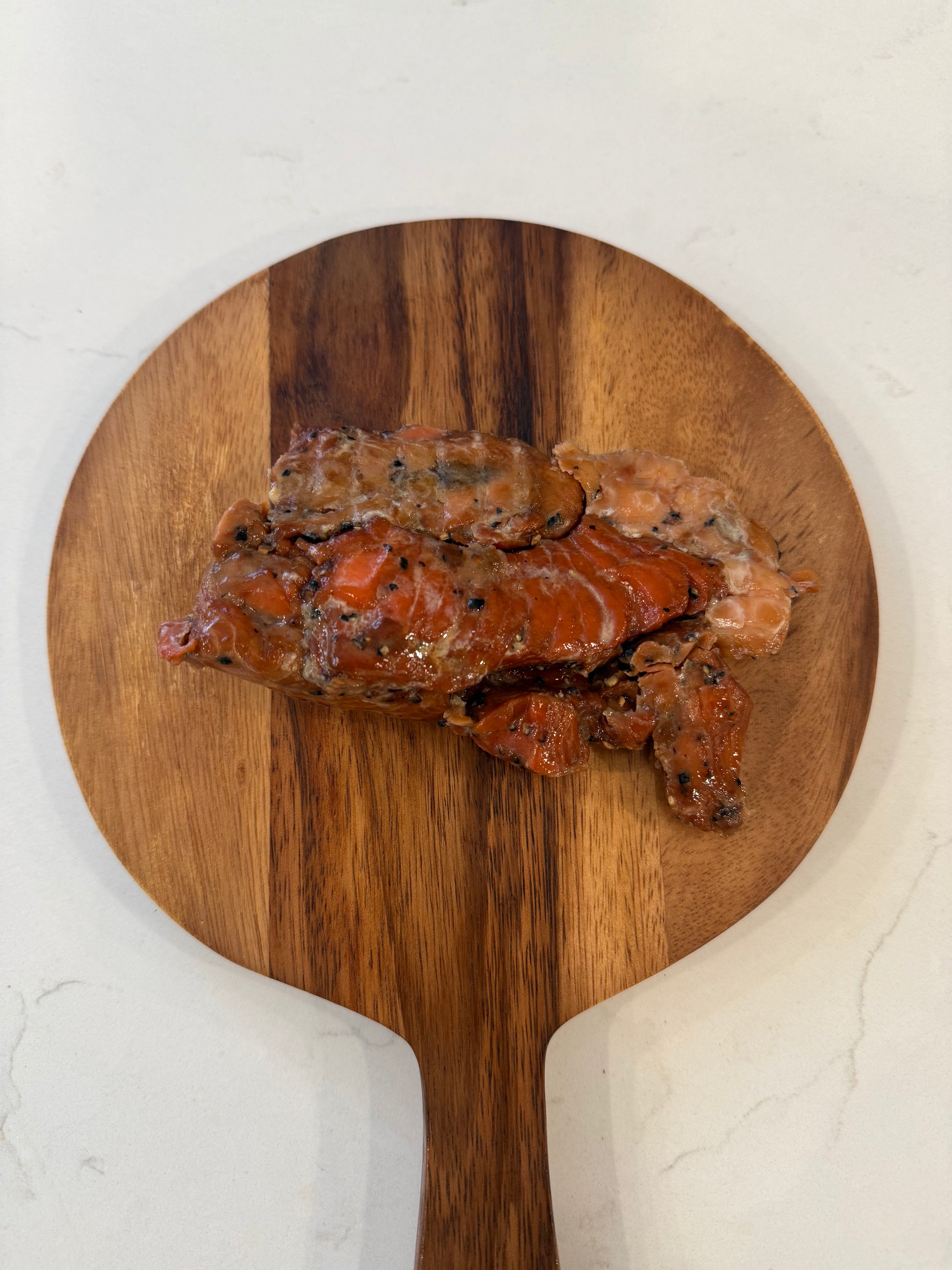 alaskan-salmon-jerky-salt-pepper-round-cutting-board.jpg
wild-sockeye-jerky-rustic-wooden-board-display