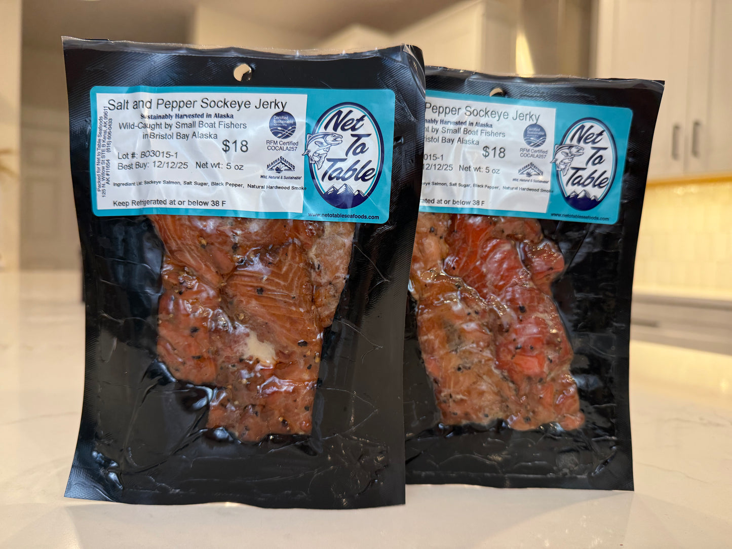 Two packages of salt and pepper sockeye salmon jerky from Net to Table, wild-caught Bristol Bay Alaska, 5oz vacuum-sealed bags