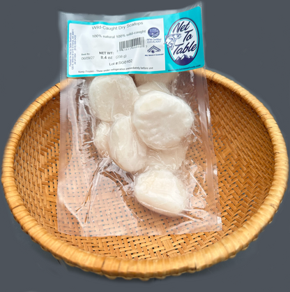 Package of wild-caught dry scallops from Net to Table Seafoods in woven basket, sustainably harvested Alaskan scallops, 100% natural chemical-free flash-frozen